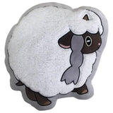 Coussin Moumouton en forme de mouton, toison bouclée blanche et tête brune, vu de face