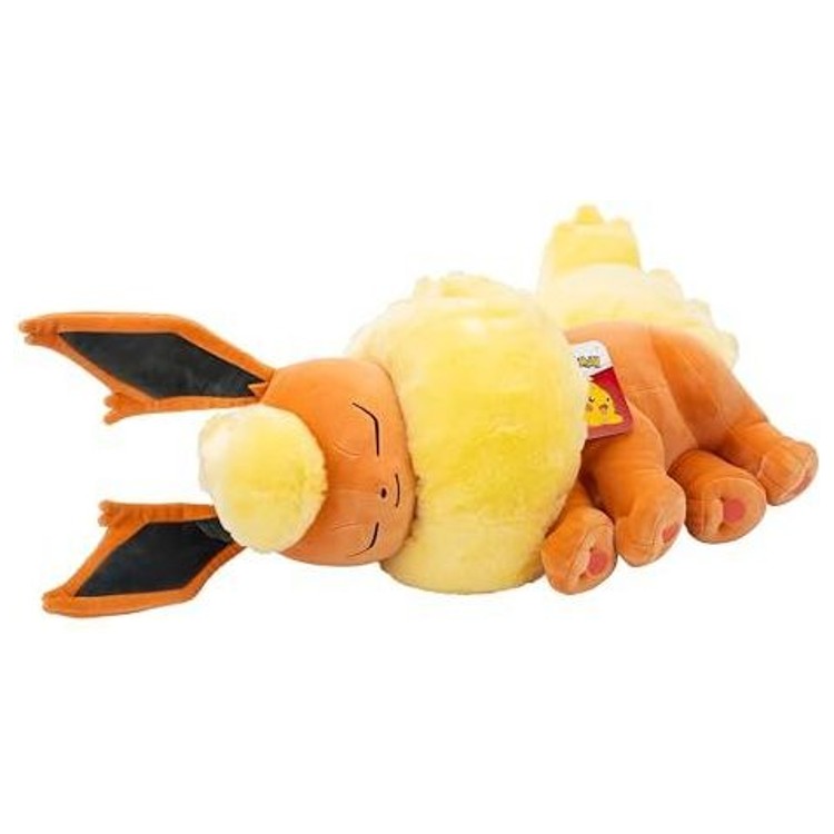 Peluche Pyroli 45 cm installée sur un lit dans une chambre d’enfant, utilisée comme élément décoratif chaleureux.