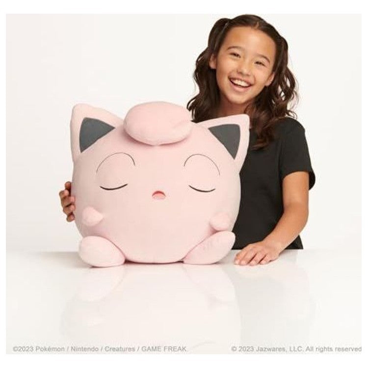 Gros plan sur le visage de la peluche Rondoudou 46 cm, détaillant la broderie des yeux et de la bouche endormie.